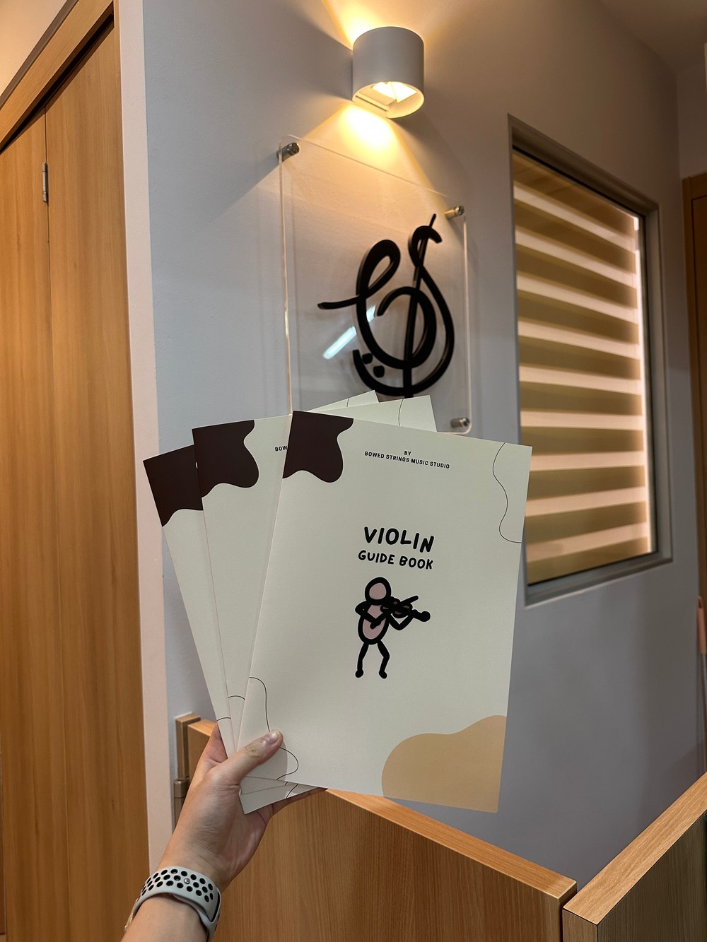 The Bowed Strings violin guide book at the studio reception