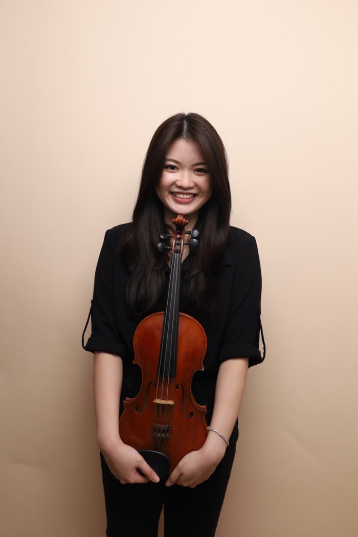 A Bowed Strings violin instructor with her violin